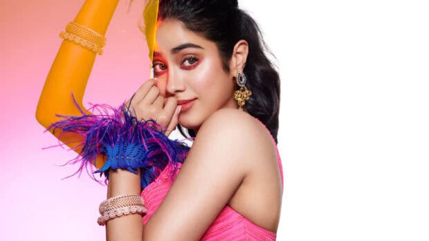 A Bollywood actress poses with colorful accessories wearing a pink outfit, 4K Mobile Wallpaper