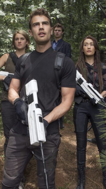 The main characters hold futuristic rifles in a forest setting in Allegiant Wallpapers, 4K Mobile Wallpaper