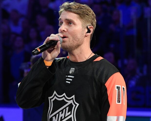 Brett Young Wallpapers singer performs live at an NHL game with intense focus, HD Desktop Wallpaper