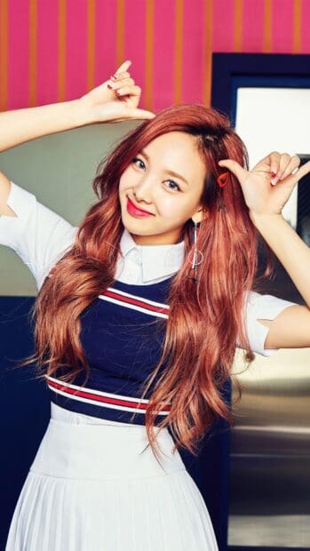 Nayeon shows a bright smile with vibrant red hair in a playful pose, HD Phone Wallpaper