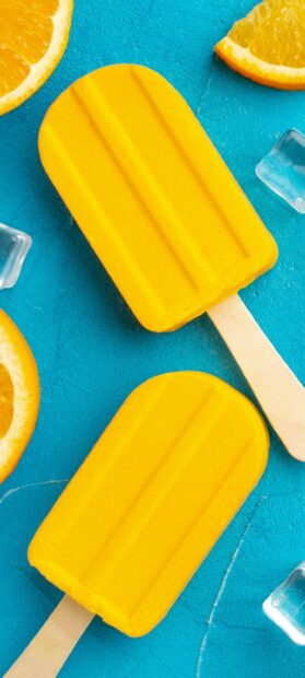 Refreshing yellow popsicles with orange slices and ice cubes, 2K Mobile Wallpaper