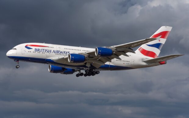 A British Airways Airbus A380 flies under a cloudy sky with landing gear down, 2K Desktop Wallpaper