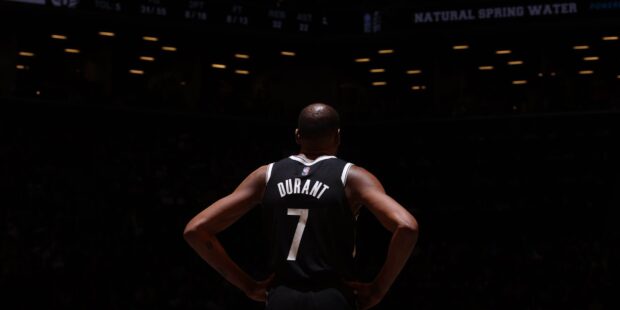 Kevin Durant stands with Brooklyn Nets jersey on court, HD Desktop Wallpaper
