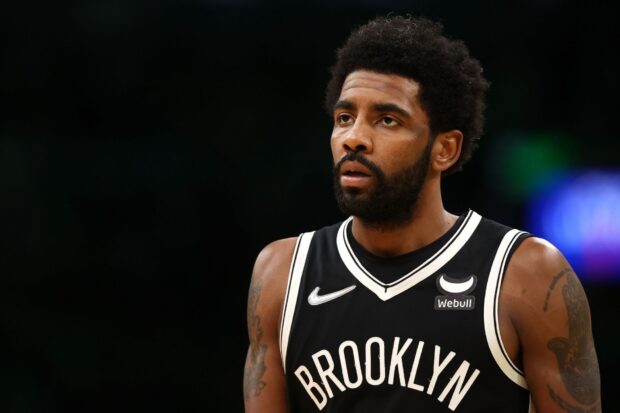 A Brooklyn Nets player is concentrating on the basketball game wearing a black jersey, HD Desktop Wallpaper