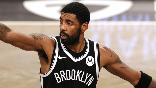 A Brooklyn Nets player is focused during a basketball game on the court, 4K Desktop Wallpaper