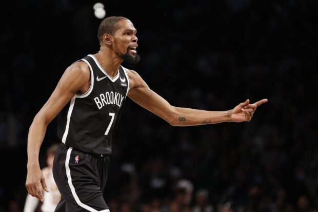 A Brooklyn Nets player is directing teammates during a basketball game, HD Desktop Wallpaper