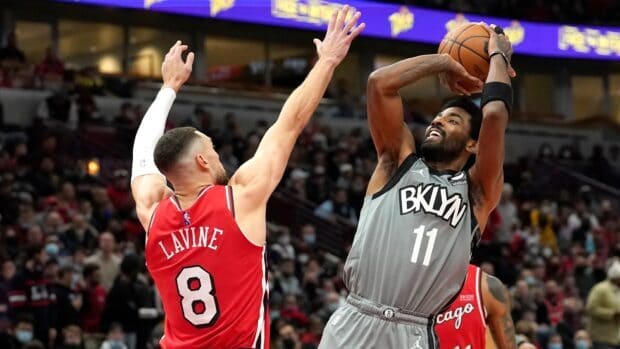 A Brooklyn Nets player is shooting the ball over a defender during a game, HD Desktop Wallpaper