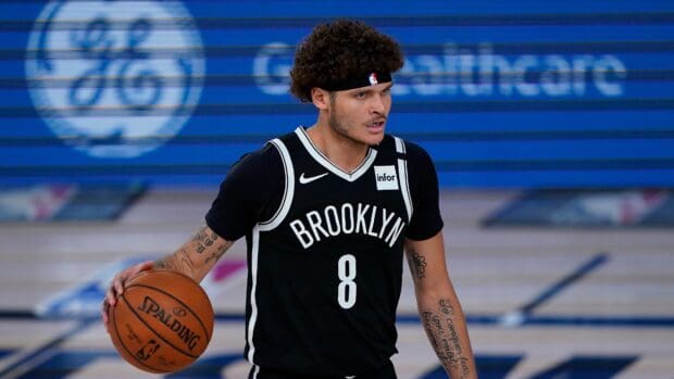 A Brooklyn Nets player is dribbling the basketball during a game, 4K Desktop Wallpaper