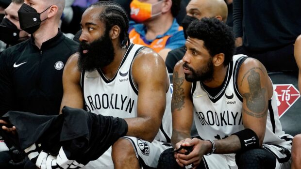 Two Brooklyn Nets players rest during a basketball game on the bench, HD Desktop Wallpaper