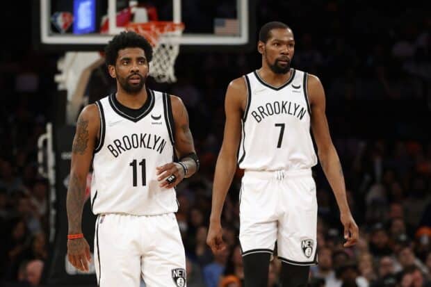 Two Brooklyn Nets players stand focused during the game, HD Desktop Wallpaper