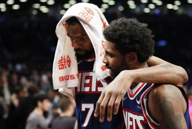 Two Brooklyn Nets players share a moment of support after the game, HD Desktop Wallpaper