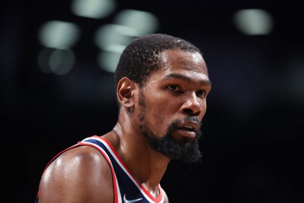 A close up of a Brooklyn Nets player intensely focused on the basketball game, HD Desktop Wallpaper