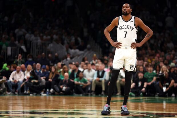A Brooklyn Nets star player stands focused during the game, HD Desktop Wallpaper