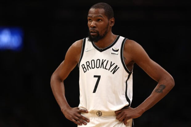 A Brooklyn Nets player wearing jersey number 7 stands focused during a game, 2K Desktop Wallpaper