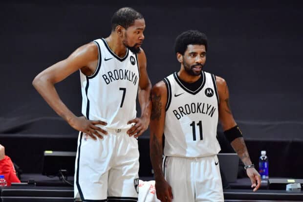 Two Brooklyn Nets players discussing strategy during a game, 2K Desktop Wallpaper