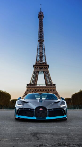 A Bugatti Divo is parked with the Eiffel Tower visible in the background during sunset, 2K Phone Wallpaper