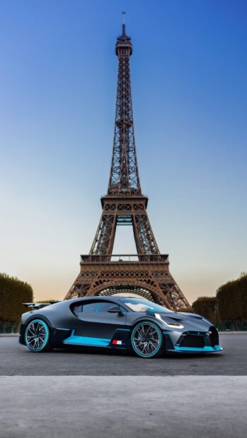 A Bugatti Divo is parked near the Eiffel Tower during sunset, HD Phone Wallpaper