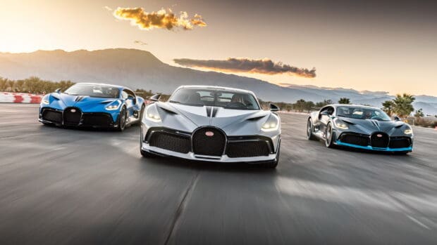 Three Bugatti Divo cars are racing on a clear road with mountains in the background, HD Desktop Wallpaper