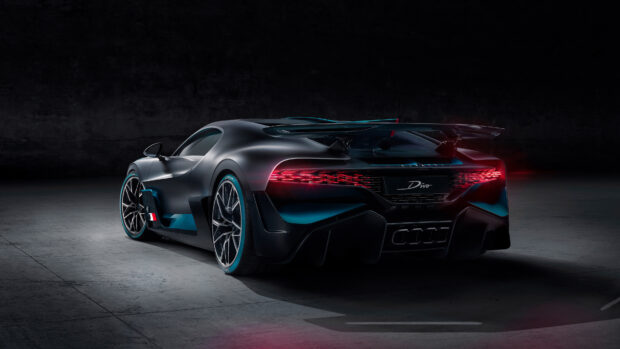 A sleek Bugatti Divo car parked in a dark setting showing its rear lights, 4K Desktop Wallpaper