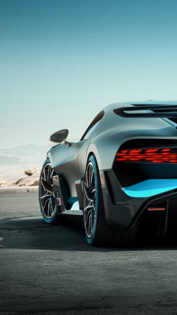 The Bugatti Divo is shown from the rear on a desert road with clear sky, 2K Phone Wallpaper