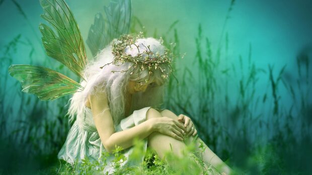 A peaceful fairy with delicate wings sits quietly among green foliage, Faeries Fairies Wallpapers, 4K Desktop Wallpaper
