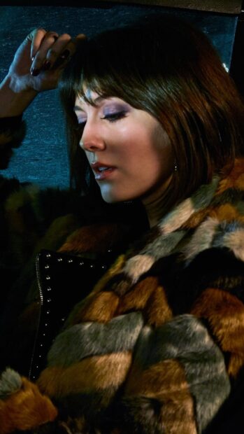 A woman wearing a fur coat enjoys a calm moment in low light featuring Fargo Wallpapers, HD Mobile Wallpaper