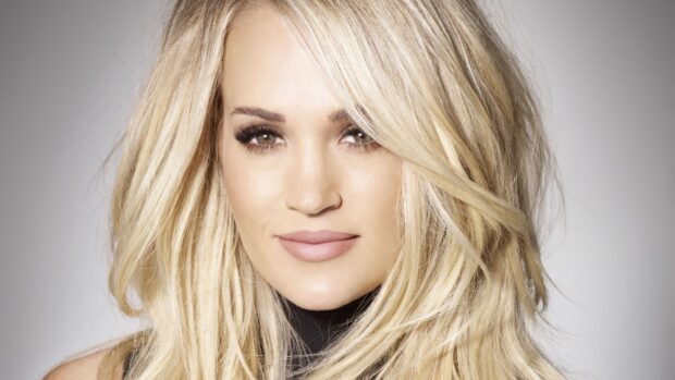A close up portrait of Carrie Underwood with blonde hair and a neutral expression, 4K Desktop Wallpaper