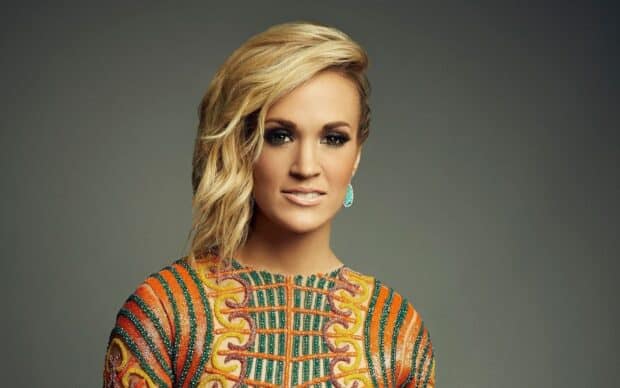 Carrie Underwood wallpapers show her in an orange and green patterned outfit, HD Desktop Wallpaper