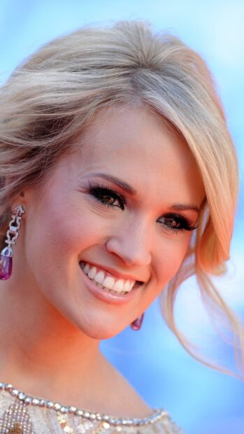 Carrie Underwood shines with a bright smile and elegant look in this close up, 2K Phone Wallpaper