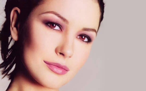 A close up portrait of Catherine Zeta Jones showing her elegant makeup and soft expression, HD Desktop Wallpaper