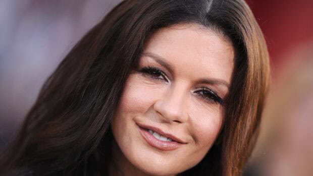 Catherine Zeta Jones displays a warm smile with natural makeup in a close up portrait, 4K Desktop Wallpaper