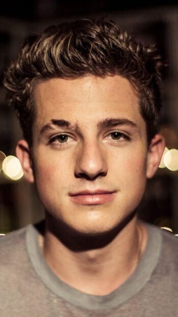 A close up portrait of Charlie Puth with natural expression and textured hair, HD Phone Wallpaper