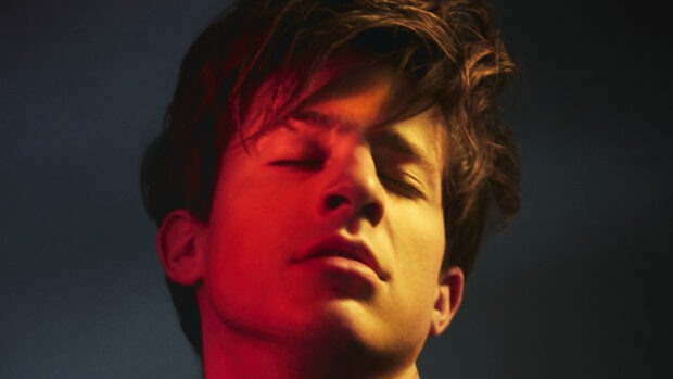 Charlie Puth close up with eyes closed in artistic lighting, 4K Desktop Wallpaper