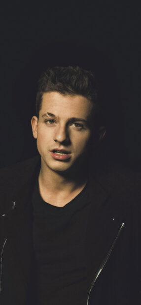 Charlie Puth looks directly at the camera with a serious expression, HD Mobile Wallpaper
