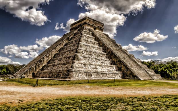 The ancient pyramid of Chichen Itza stands under a cloudy sky in Mexico, HD Desktop Wallpaper