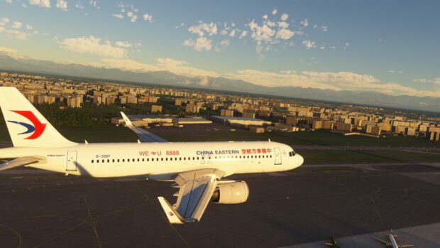 A China Eastern Airlines Airbus flying above an urban area with mountains in the background, 4K Desktop Wallpaper