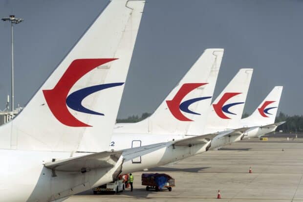 Several China Eastern Airlines planes are lined up at the airport apron, HD Desktop Wallpaper