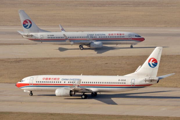Two China Eastern Airlines planes taxiing on the airport runway in clear weather, HD Desktop Wallpaper