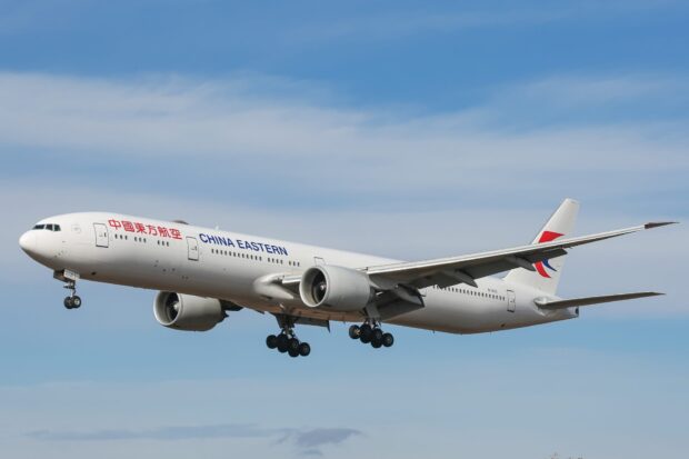 A China Eastern Airlines passenger jet is flying in a clear blue sky, HD Desktop Wallpaper