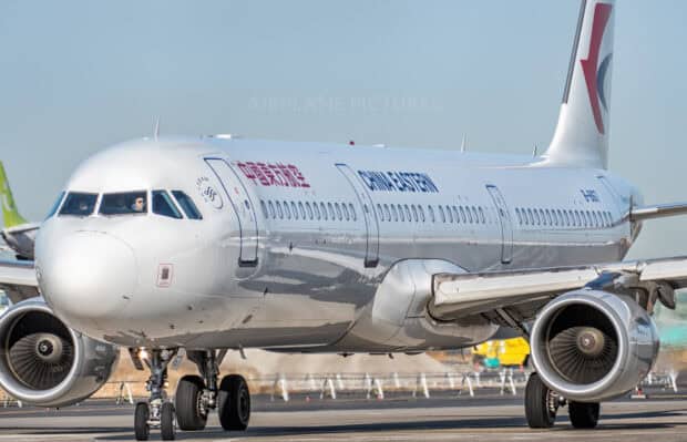 A China Eastern Airlines aircraft is taxiing at the airport under clear blue sky, HD Desktop Wallpaper