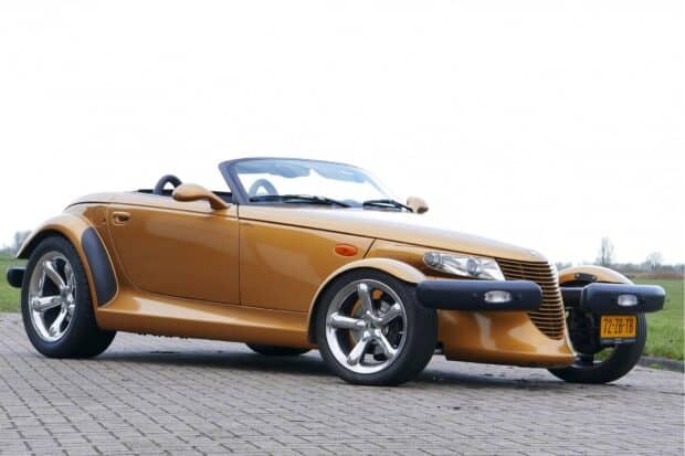 A yellow Plymouth Prowler car parked on a paved road under a cloudy sky, HD Desktop Wallpaper