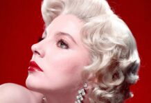 A close up profile of Joan Collins with blonde curls and red lipstick wearing sparkling earrings, HD Desktop Wallpaper