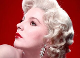 A close up profile of Joan Collins with blonde curls and red lipstick wearing sparkling earrings, HD Desktop Wallpaper
