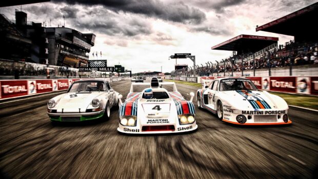 A thrilling moment with classic race cars competing on the race track, 2K Desktop Wallpaper