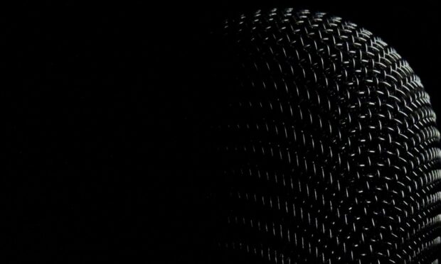 The black microphone mesh is shown in a close up with detailed texture, HD Desktop Wallpaper