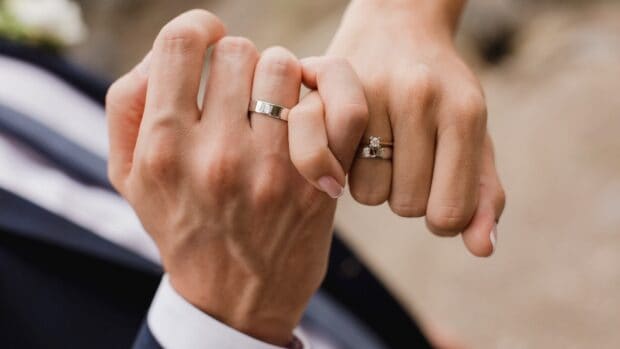 A couple showing their wedding rings while holding hands together, HD Desktop Wallpaper
