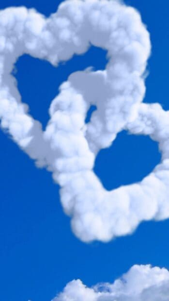 White clouds shaped like hearts float gently in the blue sky, 4K Phone Wallpaper