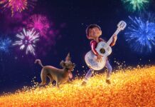 A boy is playing guitar with his dog under colorful fireworks in the night sky featuring Pixar Wallpapers, 4K Desktop Wallpaper