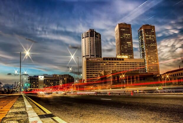 A vibrant cityscape of Colombo Sri Lanka with tall buildings and dynamic light trails, HD Desktop Wallpaper
