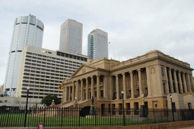 The colonial style building stands prominently in Colombo Sri Lanka with modern skyscrapers in the background, 2K Desktop Wallpaper